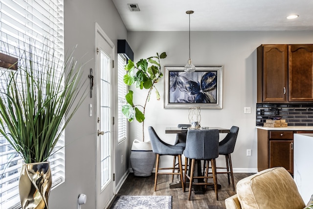 dining area with recessed lighting, visible vents, baseboards, and dark wood finished floors