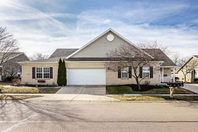 view of front facade with brick siding, driveway, an attached garage, and a shingled roof