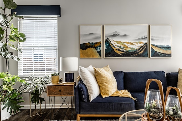 living room featuring wood finished floors and baseboards