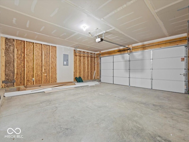 garage with electric panel and a garage door opener