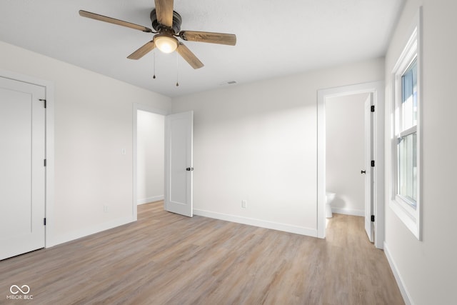 unfurnished bedroom with visible vents, baseboards, a ceiling fan, and light wood finished floors