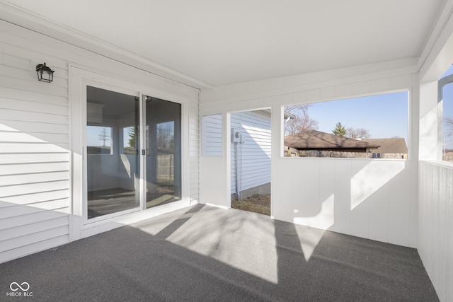 unfurnished sunroom featuring a healthy amount of sunlight