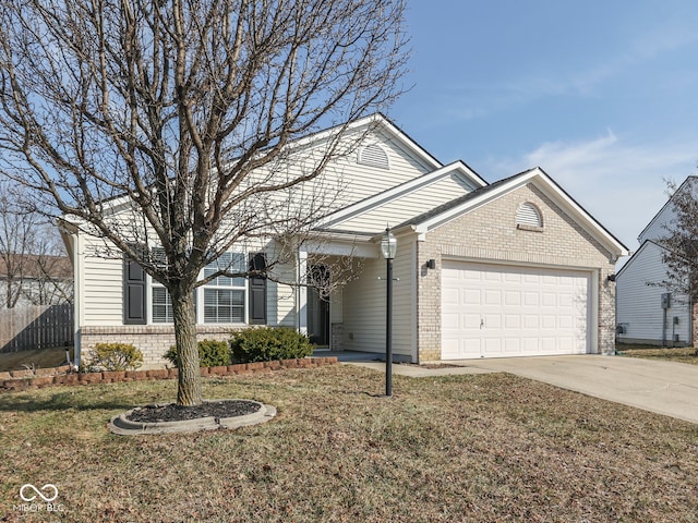 view of front of house with brick siding, driveway, an attached garage, and a front yard