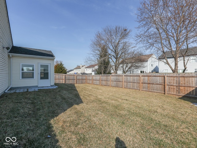 view of yard with a fenced backyard