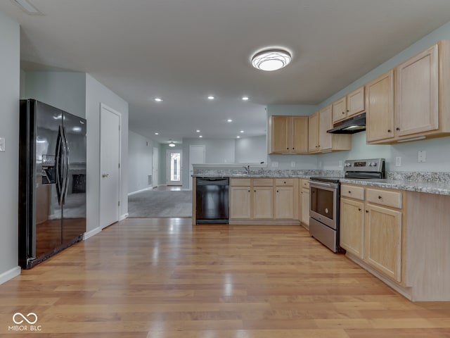 kitchen with light brown cabinetry, a peninsula, black appliances, and under cabinet range hood