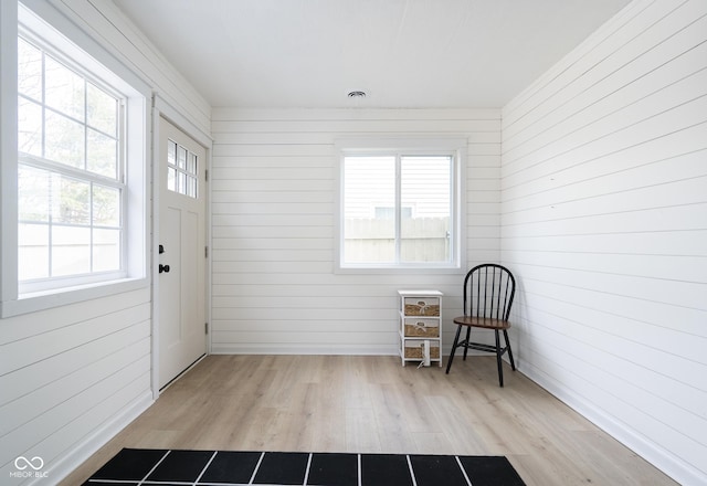 unfurnished sunroom with visible vents