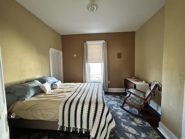 bedroom featuring baseboards