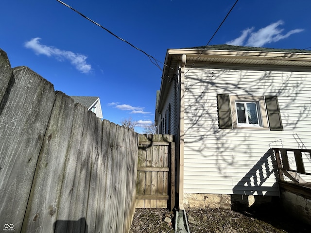 view of home's exterior featuring fence