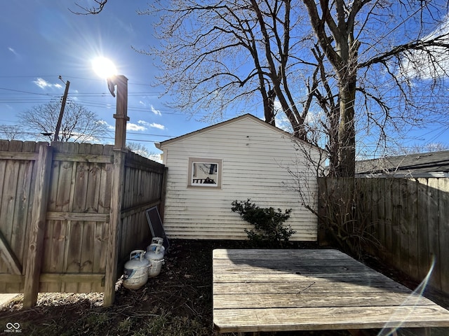 exterior space with an outdoor structure and a fenced backyard