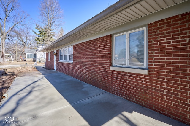 view of home's exterior with brick siding