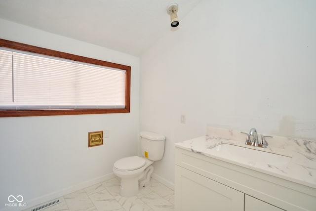 half bath featuring visible vents, baseboards, toilet, marble finish floor, and vanity