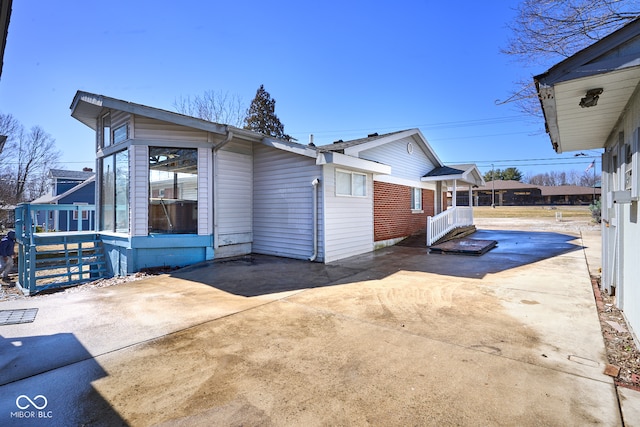 view of property exterior with driveway