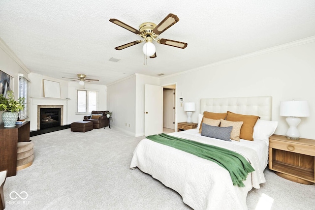 bedroom featuring visible vents, baseboards, ornamental molding, carpet floors, and a textured ceiling