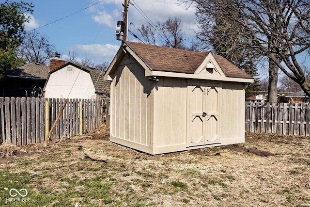 view of shed featuring a fenced backyard