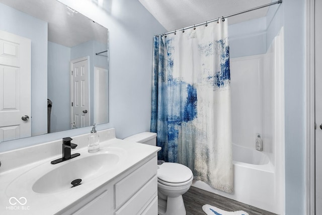 full bath featuring shower / tub combo with curtain, toilet, wood finished floors, and vanity