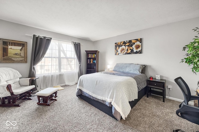 carpeted bedroom featuring a textured ceiling and baseboards