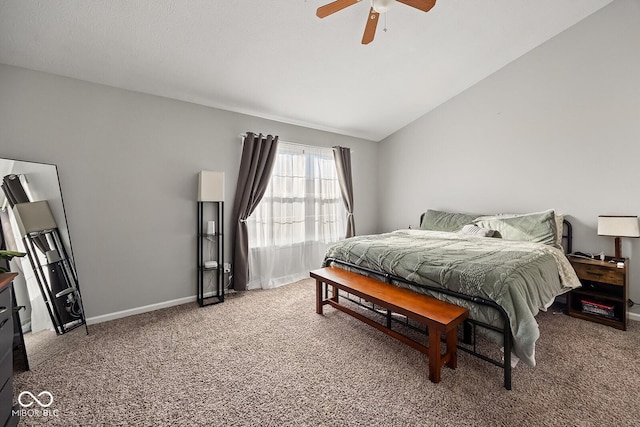 carpeted bedroom featuring lofted ceiling, a ceiling fan, and baseboards