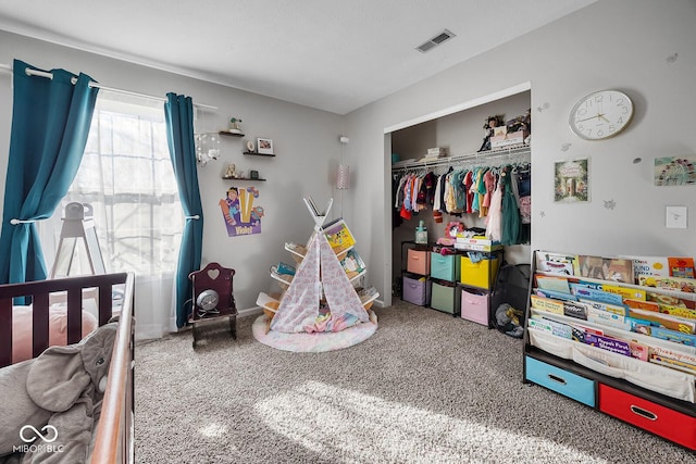 bedroom featuring visible vents and a closet