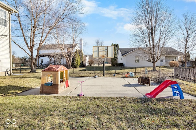 exterior space featuring a lawn and fence