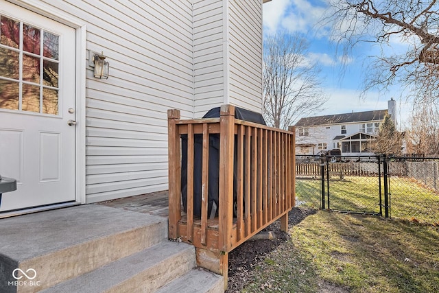 doorway to property featuring fence and a gate