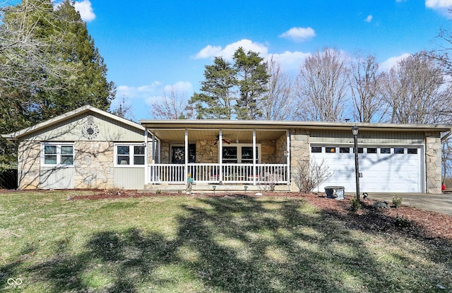 view of front of property with a ceiling fan, a porch, a front lawn, a garage, and stone siding