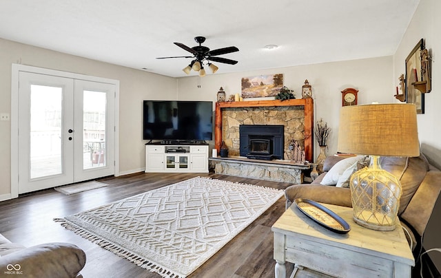 living area featuring ceiling fan, french doors, baseboards, and wood finished floors