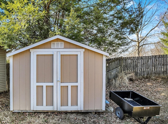 view of shed with fence