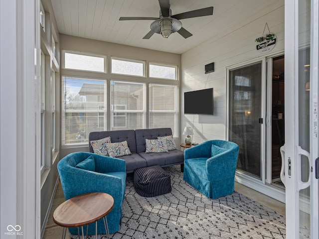 sunroom with wooden ceiling and a ceiling fan