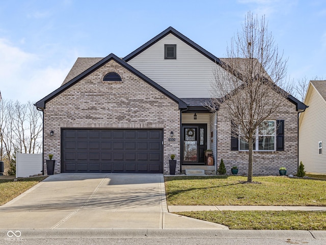 view of front of house featuring brick siding, an attached garage, concrete driveway, and a front lawn