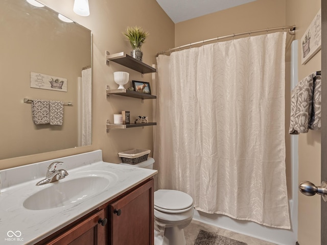 bathroom with toilet, vanity, and shower / tub combo