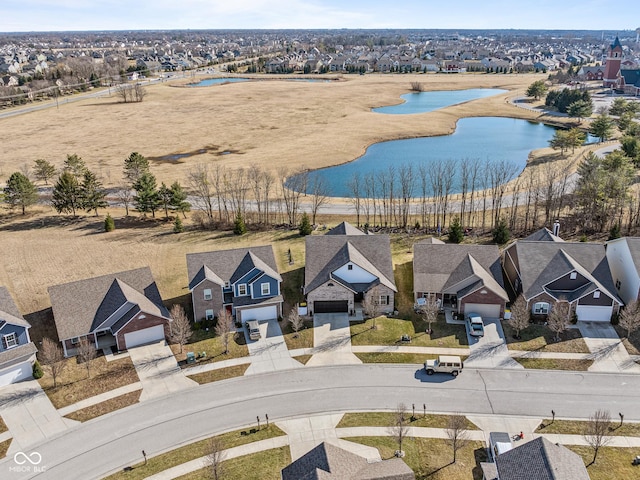 aerial view featuring a residential view and a water view