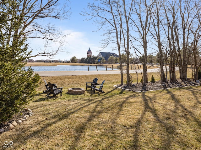 view of water feature with a fire pit