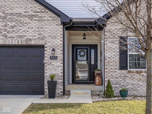 property entrance with an attached garage, brick siding, and roof with shingles