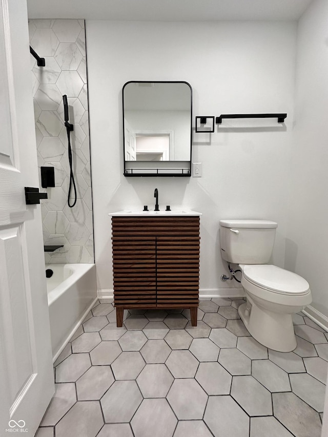 full bath featuring baseboards, washtub / shower combination, toilet, tile patterned floors, and vanity