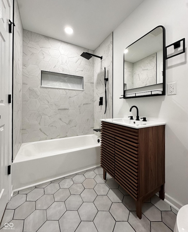 bathroom with tile patterned floors, baseboards, vanity, and shower / bathtub combination