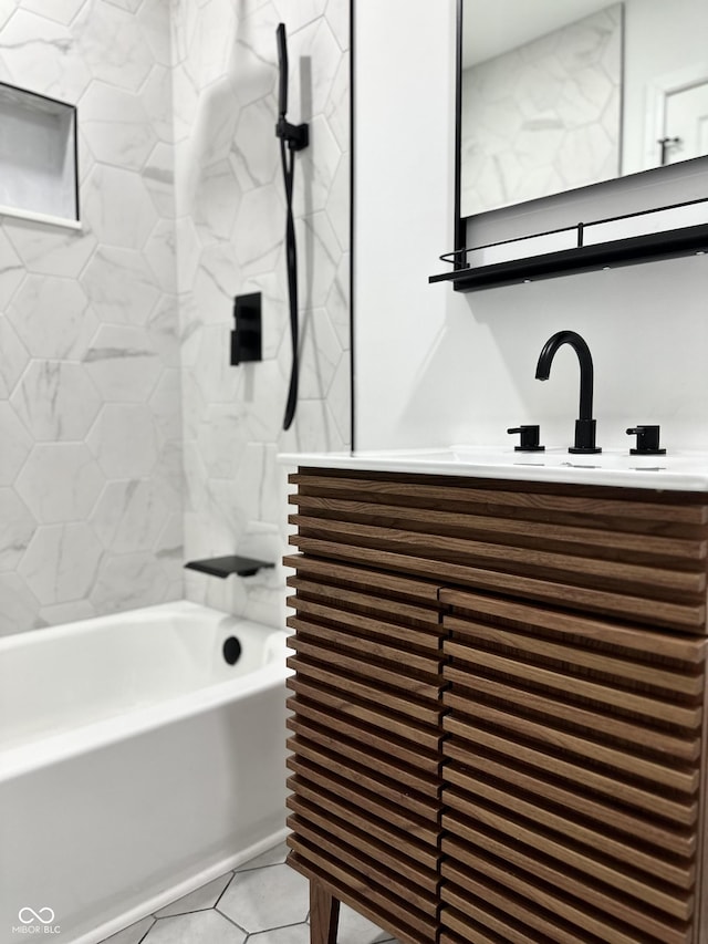 full bathroom featuring tile patterned flooring, shower / bathing tub combination, and vanity