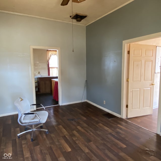 interior space with crown molding, dark wood-style floors, baseboards, and ceiling fan