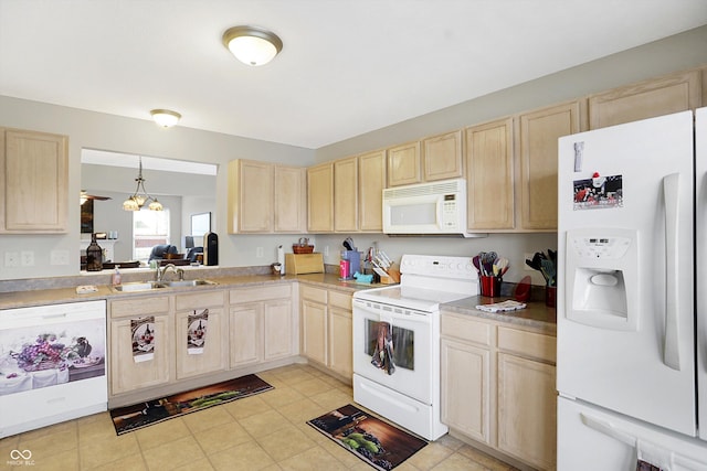 kitchen with light brown cabinets, white appliances, light countertops, and a sink