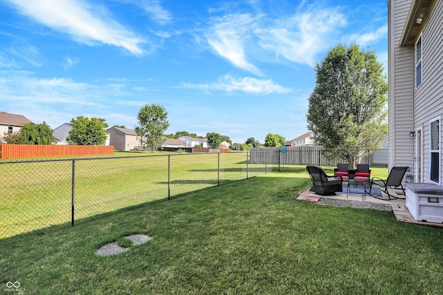 view of yard with a patio area, a residential view, outdoor lounge area, and a fenced backyard