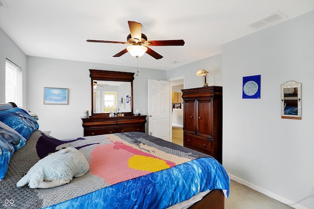 bedroom featuring visible vents, multiple windows, carpet, and a ceiling fan