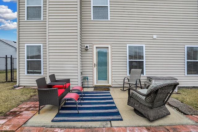 view of patio featuring an outdoor hangout area and fence