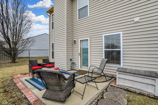 view of patio / terrace featuring fence