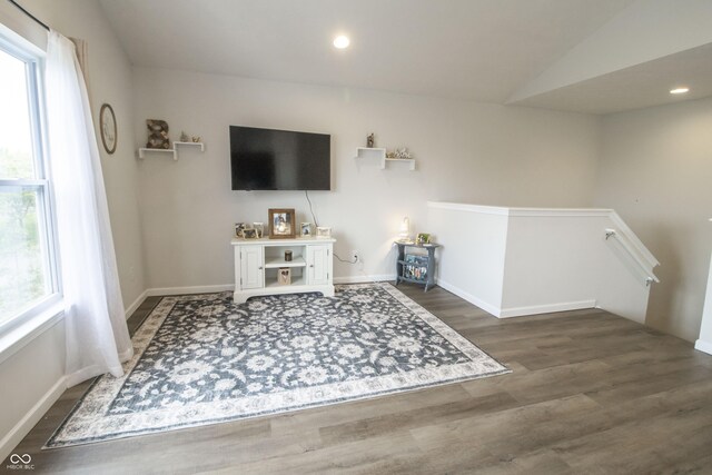 12145 Bubbling Brook Dr Unit 600, Fishers, IN 46038 - living area with wood finished floors, baseboards, recessed lighting, and vaulted ceiling