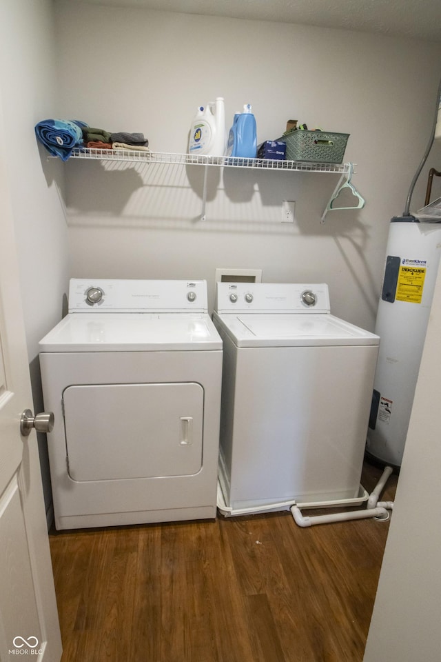 12145 Bubbling Brook Dr Unit 600, Fishers, IN 46038 - clothes washing area featuring water heater, washing machine and dryer, and dark wood finished floors