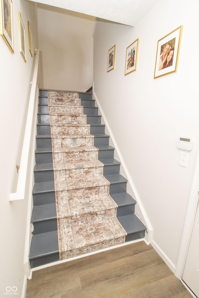 12145 Bubbling Brook Dr Unit 600, Fishers, IN 46038 - stairs with wood finished floors and baseboards