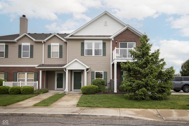 12145 Bubbling Brook Dr Unit 600, Fishers, IN 46038 - townhome / multi-family property with brick siding and a front lawn