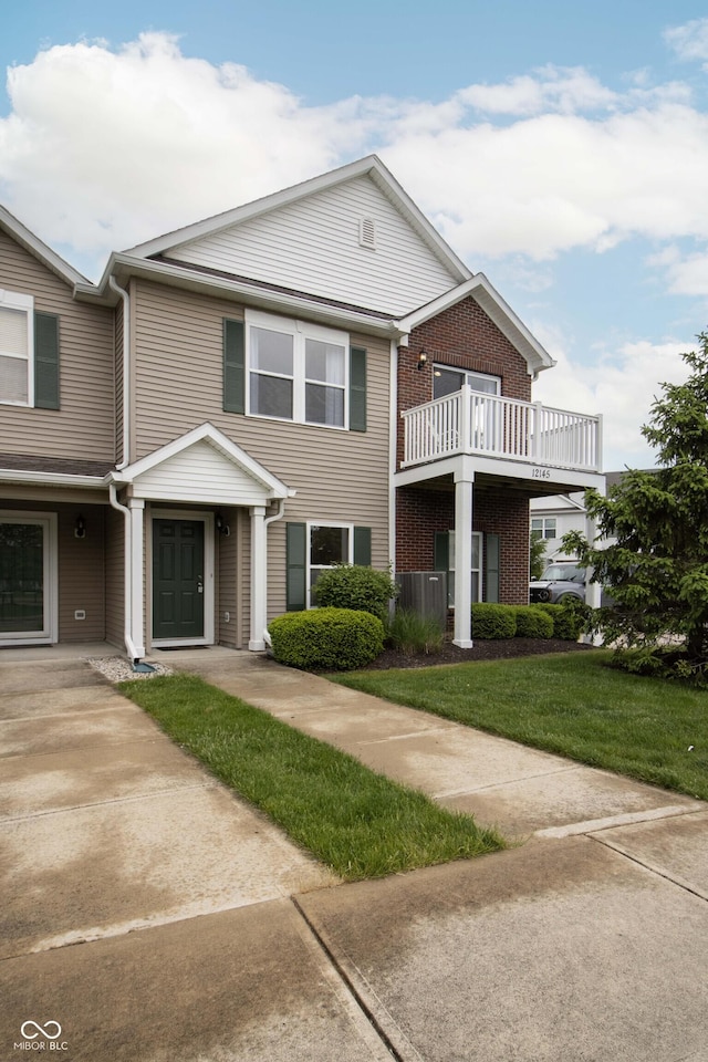 12145 Bubbling Brook Dr Unit 600, Fishers, IN 46038 - view of front facade with a front yard and brick siding
