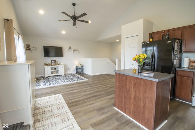 12145 Bubbling Brook Dr Unit 600, Fishers, IN 46038 - kitchen with lofted ceiling, a center island, a ceiling fan, wood finished floors, and open floor plan
