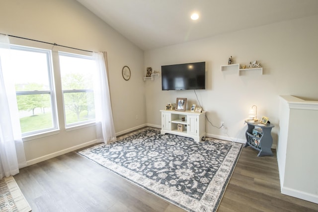 12145 Bubbling Brook Dr Unit 600, Fishers, IN 46038 - living room with wood finished floors, vaulted ceiling, and baseboards