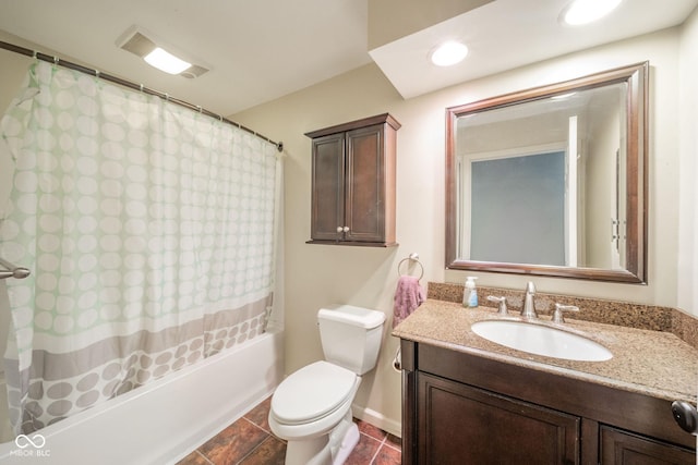 bathroom featuring shower / tub combo, toilet, vanity, and tile patterned flooring